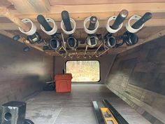 there are many cameras mounted to the ceiling in this vehicle's storage area,