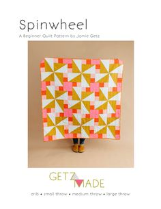 the cover of spinwheel quilt pattern is shown in orange and white, with an image of