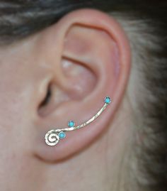 ⋙ 14kt Gold Filled turquoise ear climber.⋙ This listing is for one ear climber.⋙ Available gemstones: ruby; lapis lazuli; black onyx; emerald; light blue opal; garnet; white opal; kiwi green opal; amethyst; aqua blue cz; clear cz; black-red opal; turquoise; blue sapphire⋙ Measurements:⋙ The stone is 2mm in diameter⋙ ⋙ I will put your order into a beautiful jewelry box (it will be ready for gift giving). Ear Climber Earrings Gold, Watermelon Tourmaline Jewelry, Ear Wraps, Turquoise Bar, Silver Ear Climbers, Red Opal, Ear Climbers Earrings, Emerald Blue, Ear Climber