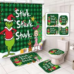 the grinch bathroom is decorated with green and red christmas themed decor, including toilet covers, rugs, and shower curtain