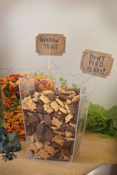 there are many different types of food in this display case, including carrots and corn flakes