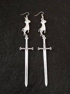 Hands and swords antique silver earrings, medieval earrings, gothic earrings, medieval wedding, gothic wedding The sword may contains a sharped edge. Use it at your own discretion. Medieval Style Nickel-free Silver Earrings, Medieval Earrings, Wedding Gothic, Antique Silver Earrings, Earrings Gothic, Medieval Wedding, Gothic Earrings, Medieval Times, Gothic Wedding