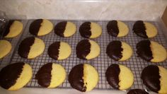 chocolate and yellow cookies cooling on a rack in the oven, ready to be baked