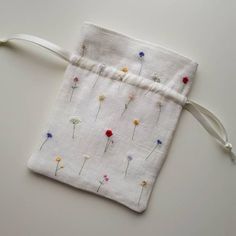 a small pouch with flowers on it