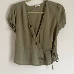 Nwot Sage Green Babydoll Top Size M Wraps And Ties On The Side Of The Top Buttons Are For Decoration Never Worn Cute Fitted Green Blouse, Olive Short Sleeve Top For Summer, Cute Green Short Sleeve Blouse, Babydoll Top, On The Side, Sage Green, Baby Dolls, The Top, Top Blouse