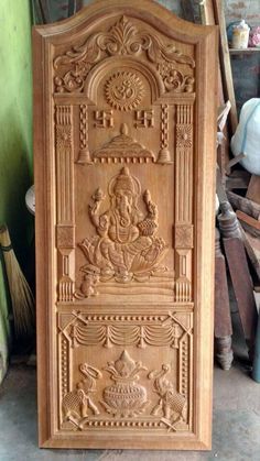 an intricate carved wooden door in a shop