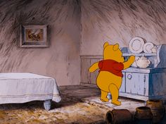 winnie the pooh standing in front of a bed