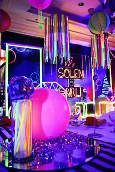 a room filled with lots of colorful lights and decorations