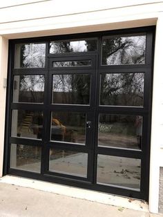 an open black door with glass panes on the outside