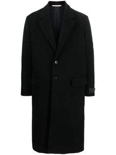 Valentino Ready To Wear black wool blend notched lapels front button fastening shoulder pads long sleeves buttoned cuffs two front flap pockets central rear vent below-knee length straight hem The full look includes Valentino Garavani accessories. Black Long Wool Coat With Concealed Fastening, Black Wool Long Coat With Concealed Front, Business Long Coat With Concealed Fastening, Designer Single Button Outerwear For Business, Classic Black Wool Coat With Concealed Fastening, Black Wool Blazer With Concealed Fastening, Modern Black Wool Coat With Button Closure, Modern Black Wool Coat With Concealed Placket, Classic Long Wool Coat With Concealed Fastening