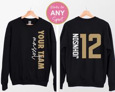 two black sweatshirts with gold numbers on the front and back, one is for men