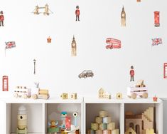 the children's room is decorated with toys and wall decals that include british symbols