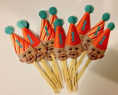 a bunch of small toothpicks with faces on them