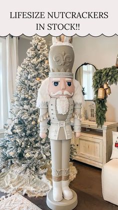 a nutcracker statue in front of a christmas tree with the words lifesize nutcrackers in stock