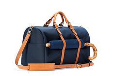 Stuart & Lau | The Monaco - Men's Weekender Bag - Navy and Tan Functional Weekend Travel Bag With Luggage Sleeve, Waterproof Nylon Weekender Bag For Travel, Nylon Duffle Bag For Weekend Trips, Weekender Bag With Leather Trim For Weekend Trips, Nylon Weekender Bag With Luggage Sleeve, Nylon Weekender Bag With Luggage Sleeve For Trips, Nylon Weekender Bag With Luggage Sleeve For Weekend Trips, Nylon Travel Bag With Leather Trim, Nylon Weekender Bag With Top Carry Handle For Travel