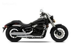 a black motorcycle is shown on a white background