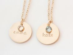 "This listing features 1-3 medium 5/8\" 14K gold filled discs hand stamped with a name. Attached to the disc is a faceted swarovski birthstone to represent your little ones birth month. Suspended from a 14K Gold filled cable chain as shown. Also available in sterling silver here: https://www.etsy.com/listing/475806906/personalized-birthstone-necklace-name?ref=shop_home_active_11&frs=1" Gold Birthstone Necklace With Name On Round Pendant, Personalized Round Gold Birthstone Necklace, Gold Hand Stamped Necklace For Birthday, Personalized Name Charm Necklaces, Gold Hand Stamped Necklace For Birthday Gift, Gold Birthstone Necklace, Necklace Emerald, Emerald Birthstone, Gold Name Necklace