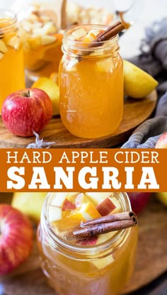 two jars filled with apple cider sanggria on top of a cutting board