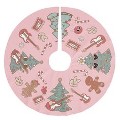 a pink christmas tree skirt with gingerbreads and candy canes