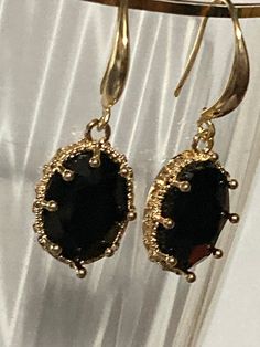 18k gold plated black glass crystal diamanté ornate deep set oval crystal cabochon drop charm earrings  many others colours in the range  The earwires are nickel free,18k gold rhodium plated on a copper base metal Gold Teardrop Cabochon Jewelry, Gold Oval Earrings For Evening, Elegant Cabochon Drop Earrings, Elegant Metal Jewelry With Oval Pendant, Elegant Gemstone Metal Earrings, Oval Jewelry With French Hook For Gifts, Oval Metal Jewelry For Formal Occasions, Elegant Metal Oval Pendant Jewelry, Formal Oval Metal Jewelry