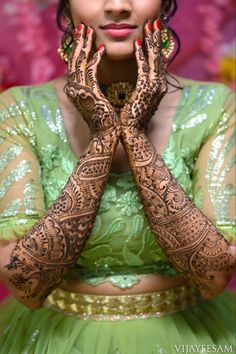 a woman with henna on her hands