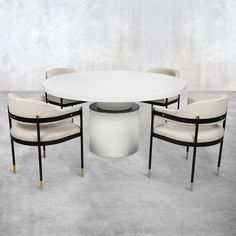 a white table with four chairs around it