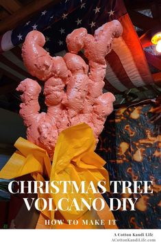 a christmas tree made out of volcanos in front of an american flag with text overlay that reads, christmas tree volcano how to make it