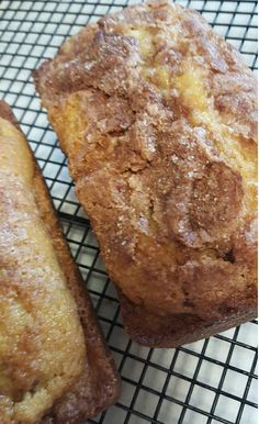 two pastries sitting on top of a cooling rack