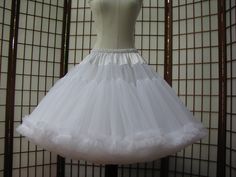 "This listing is for a custom order for a super-full double layer nylon organdy petticoat with satin waist and chiffon bottom ruffles. The pictured petticoat was designed for a 31\" (78,5cm) waist and is 24\" (61cm) long. It is displayed on a dress form with a 22\" (55cm) waist. You can choose any length you need. I will lengthen each of the tiers to achieve extra length. If you would prefer that I add another tier to achieve extra length, then the price will increase substantially. If you would Elegant Organza Petticoat With Tulle Skirt, Elegant Fitted Ruffles Petticoat, Elegant Fitted Ruffled Petticoat, Wedding Stretch Petticoat With Tiered Skirt, Wedding Stretch Tiered Petticoat, Elegant Organza Petticoat For Wedding, Elegant Organza Wedding Petticoat, Elegant Wedding Organza Petticoat, Fitted Full Skirt Petticoat With Ruffles