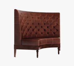 a brown leather couch sitting on top of a wooden frame