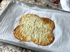 an uncooked cracker sitting on top of a piece of paper