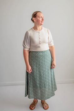 This dainty floral skirt features a flat front waistband for zero bulk, with a back elastic waist for ultimate comfort. Pair with a neutral blouse and low heels for an elegant evening look, or dress it down with a simple tee and denim jacket. This easy-to-wear skirt will become a simple staple. Style: fully lined, floral gathered skirt Color: pine Fabric content: 100% polyester(self) 94% polyester 6% spandex(lining) Care instructions: wash gentle cycle, cold; lay flat to dry, cool iron if needed Neutral Blouse, Be Intentional, Modest Skirts, Summer Cottage, Floral Maxi Skirt, Modest Clothing, Simple Tees, Floral Midi Skirt, Gathered Skirt