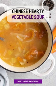 a white bowl filled with soup next to carrots