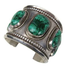 Massive bracelet with large scale Malachite stones set in this one. It measures 2.05 in wide 1.11 in x .76 in largest stone in the center 1.14 in opening will fit a size 6-7 in wrist and does have a bit of give. This is out of a massive collection of Hopi, Zuni, Navajo, Southwestern, sterling silver, costume jewelry and fine jewelry. Be sure to check our store front for more fabulous pieces from this collection. We have been selling this collection on 1st dibs since 2013. You can Follow us via s Amethyst Bangle, Vintage Cuff Bracelet, Unique Fashion Jewelry, Malachite Jewelry, American Indian Jewelry, Southwest Jewelry, Navajo Jewelry, Sterling Jewelry, Pink Bracelet