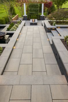 an outdoor patio with seating and landscaping