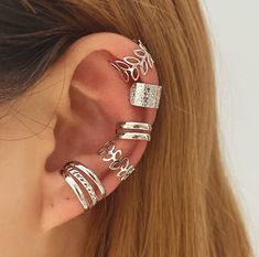 🔥 LIMITED TIME OFFER BUY 2 SETS GET 1 FREE 🔥 SET OF 5 PCS EAR CUFFS 💕You Will Get 5 Pcs Cuff Earrings in Various Styles, Dainty No Piercing Cartilage Clip On Wrap Earring Set. Hollow Cuff Earrings, Personalized Cross X, Trendy 3 Row Wrap, Classic U Shape Dome, Cartilage Earrings, Snake Cuff, etc. You Can Wear Them Individually, Side By Side, Or any Anyway You Like, Add a Unique Charm to Your Ears. QUALITY MATERIAL💕 These Ear Cuff Cartilage Earrings are Made of Soft Brass, Hypoallergenic, Lig Leaf Ear Cuffs, Fake Earrings, Fake Piercing, Snake Earrings, Ear Cuff Earings, Ear Cuffs, Mua Sắm, Cuff Earrings, Trendy Jewelry