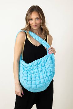 Whether for work, shopping, going to the gym, or traveling, this Large Carryall Quilted Puffer Bag for Women in Blue is the perfect accessory. Featured with a puffer quilted design and many zipper pockets, this bag is not only practical for everyday use but also super trendy and stylish! Features: Do everything in love Style: QBS320125-AQUA Color: Aqua Blue 100% Polyester Featured with fashion puffer quilted design Interior zipper pocket Zipper pocket outside side Zipper close top Lightweight W: Casual Nylon Puffer Bag, Travel Nylon Puffer Shoulder Bag, Trendy Nylon Puffer Bag, Trendy Everyday Puffer Bags, Trendy Puffer Bag, Blue Quilted Nylon Bags, Puffer Bag, Do Everything In Love, Color Aqua