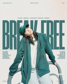 a woman standing in front of a poster with the words break free written on it