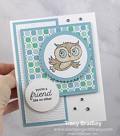 someone holding up a card with an owl on it