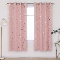 pink curtains with gold speckles on them