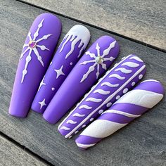 Dawn Witch Designs Unique, re-usable, hand painted, and made in Canada. These luxury press on nails are handmade using high quality gel polish and salon-grade materials.  ✨ PURPLE SNOWFALL ✨  Set on a matte purple background, this manicure features 3D icicles, snowflakes, and stripes. *The shape shown in the pictures is the LONG STILETTO *Colours may appear a little different due to your personal monitor settings* ✨ BUY 3 GET 1 PROMOTION ✨ ➜ Buy 3 sets of press on nails and get 1 set free! (Free Purple Christmas Nails Acrylic, Purple Xmas Nails, Christmas Purple Nails, Nail Art Designs For Winter Purple, Winter Nails Purple, Purple Winter Nail Designs, Christmas Nails Purple, Purple Snowflake Nails, Purple Christmas Nail Designs