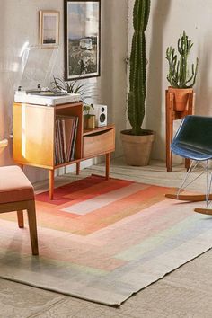 an image of a living room with furniture and rugs