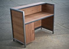 an office desk made out of wood and metal