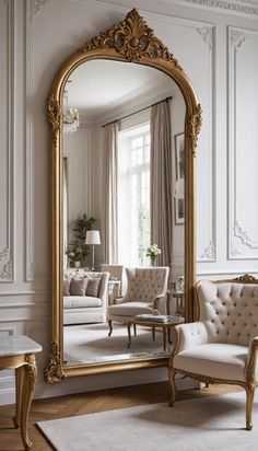 an ornate gold framed mirror in a living room