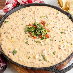 a skillet filled with quesadilla dip and tortilla chips