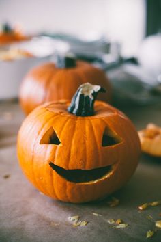 two pumpkins sitting on top of a table with the words new listeners october 2013