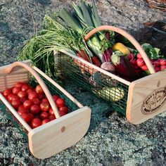 two baskets filled with vegetables sitting on top of a rock