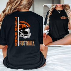 a woman sitting on top of a bed wearing a black shirt that says team name football