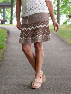 A flirty drawstring skirt in 9 sizes (XS/S/M/L/1X/2X/3X/4X/5X) to wear as a stylish alternative to shorts for summer fun. Worked in the round from waist to hem in widening panels, the fabric is solid through the hip, with openwork patterning to the knee. Stripe it for eye-catching flare or solid for a more elegant look Casual Knee-length Mini Skirt For Summer, Bohemian Stretch Gathered Skirt, Drawstring Mini Skirt For Vacation, Bohemian Stretch Mini Skirt For Summer, Summer Skirt With Drawstring, Vacation Tiered Skirt With Drawstring, Bohemian Short Length Bottoms With Drawstring, Bohemian Stretch Tiered Skirt, Summer Mini Skirt With Drawstring