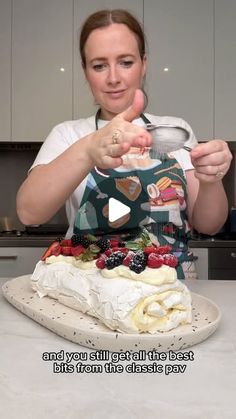 a woman is making a cake with fruit on it and the caption says,